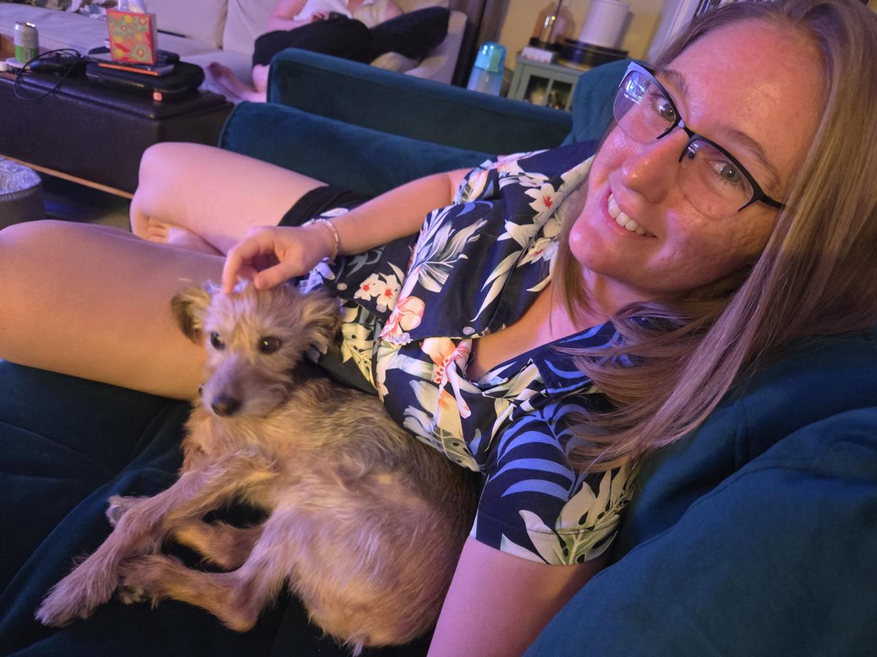 Cassie sitting next to Rocco on the sofa