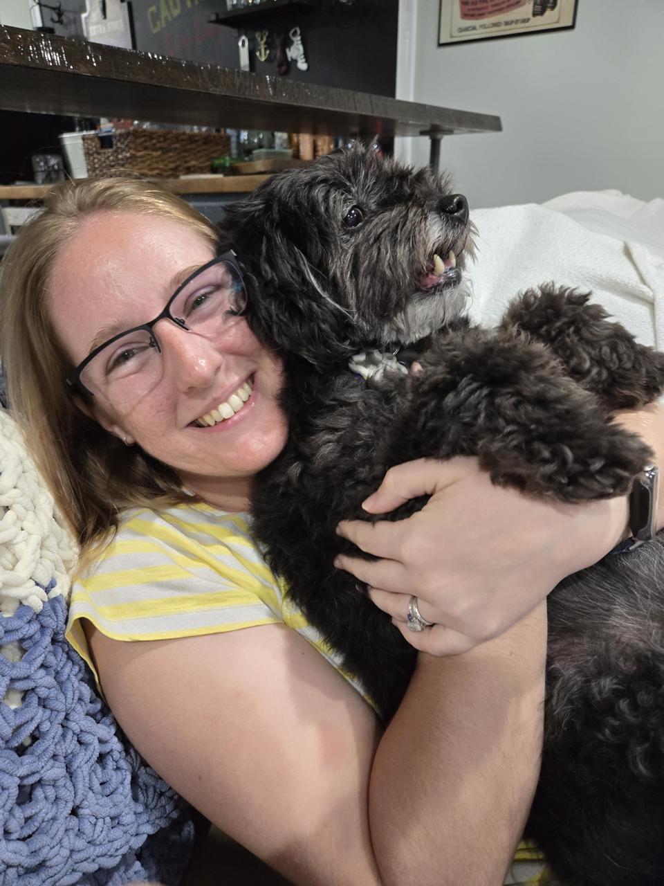 We've been getting along great with Sirius - the cats, not so much. Cassie holding Sirius