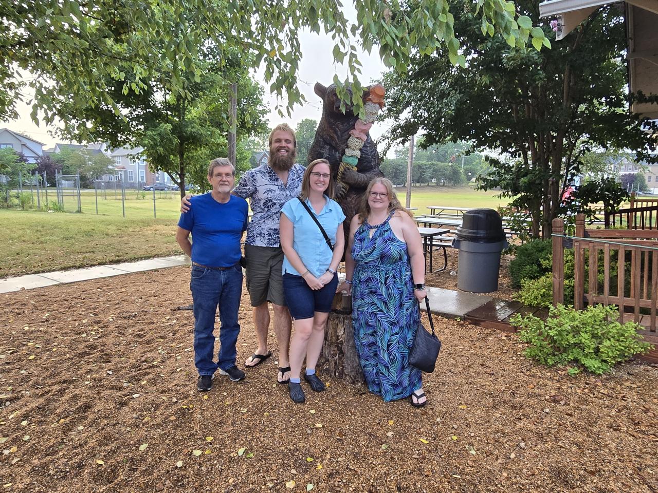 This was outside Cookies & Cream, a great little ice cream place. Teddy, Cassie, Chris, and Pam standing in front of a carved bear.